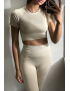 Ensemble legging et top sport beige en matière gênante - 3